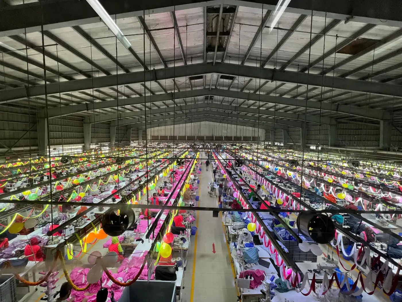 Wide view of a large garment production hall with sewing lines, partner factory in Dhaka, Bangladesh, DRESSOURCE
