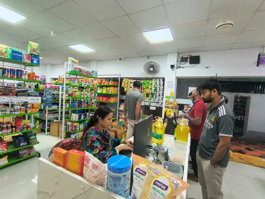 Workers at a store counter, worker welfare and fair employment at a DRESSOURCE partner factory, Bangladesh
