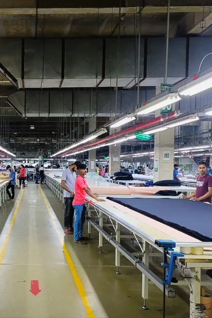 Long fabric cutting table in the cutting section of a garment factory, Dhaka, Bangladesh, DRESSOURCE